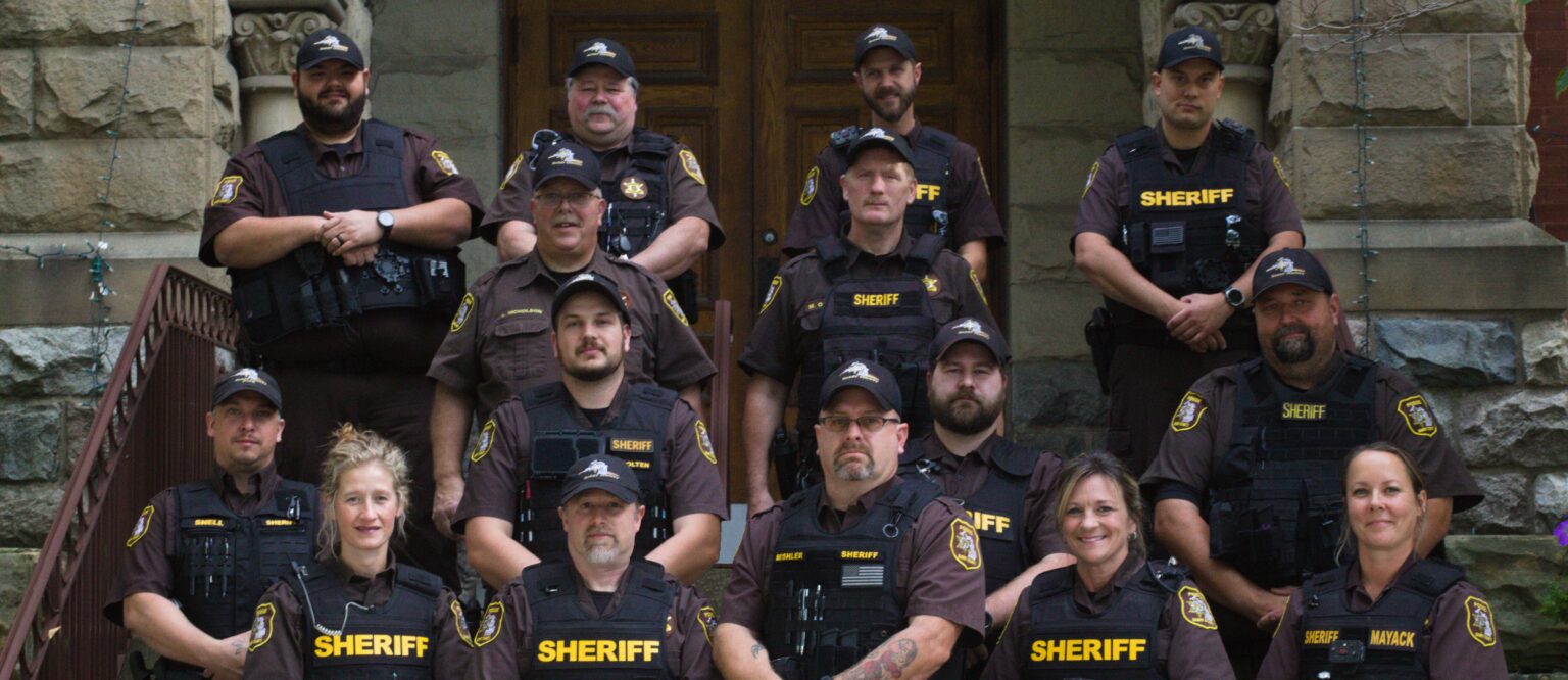 Barry County Sheriff Posse members in uniform on the courthouse steps